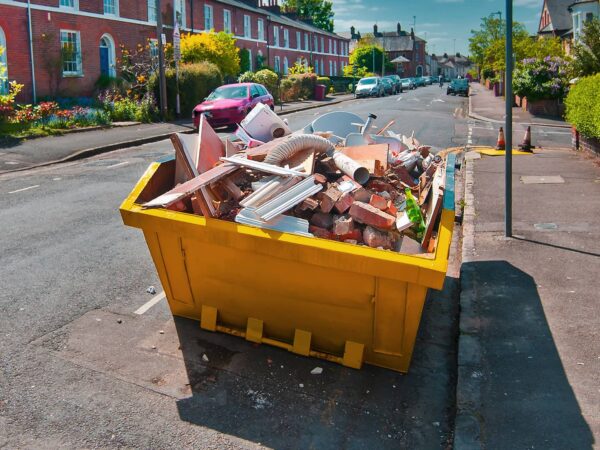 Skip on road with waste inside